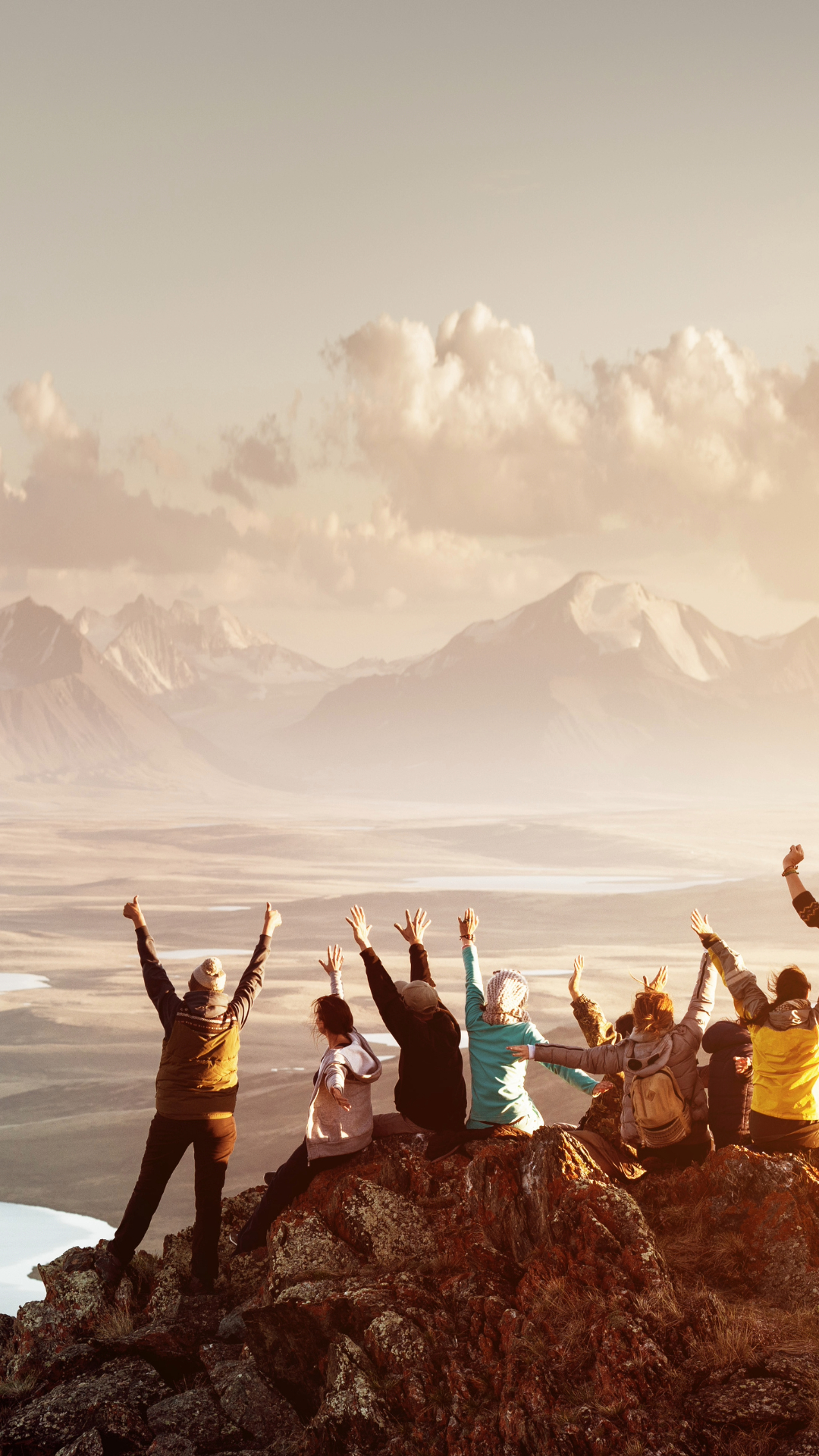 Group of Travellers on a mountain range celebrating Extreme Sports Mountain Climbing