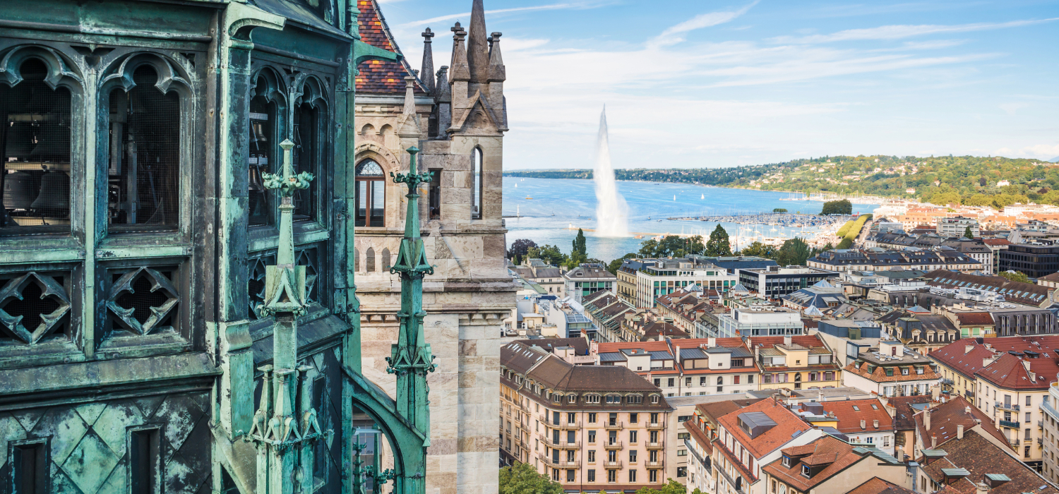 Geneva View of Fountain in Geneva with Historic Buildings in the foreground