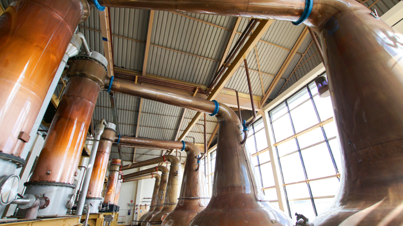 Copper stills in a whisky distillery